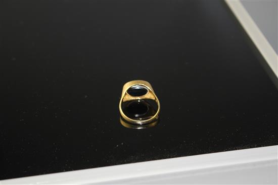 A 1970s 18ct gold, pave set diamond and black onyx set swivel head signet ring, size V, gross weight 8.5 grams.